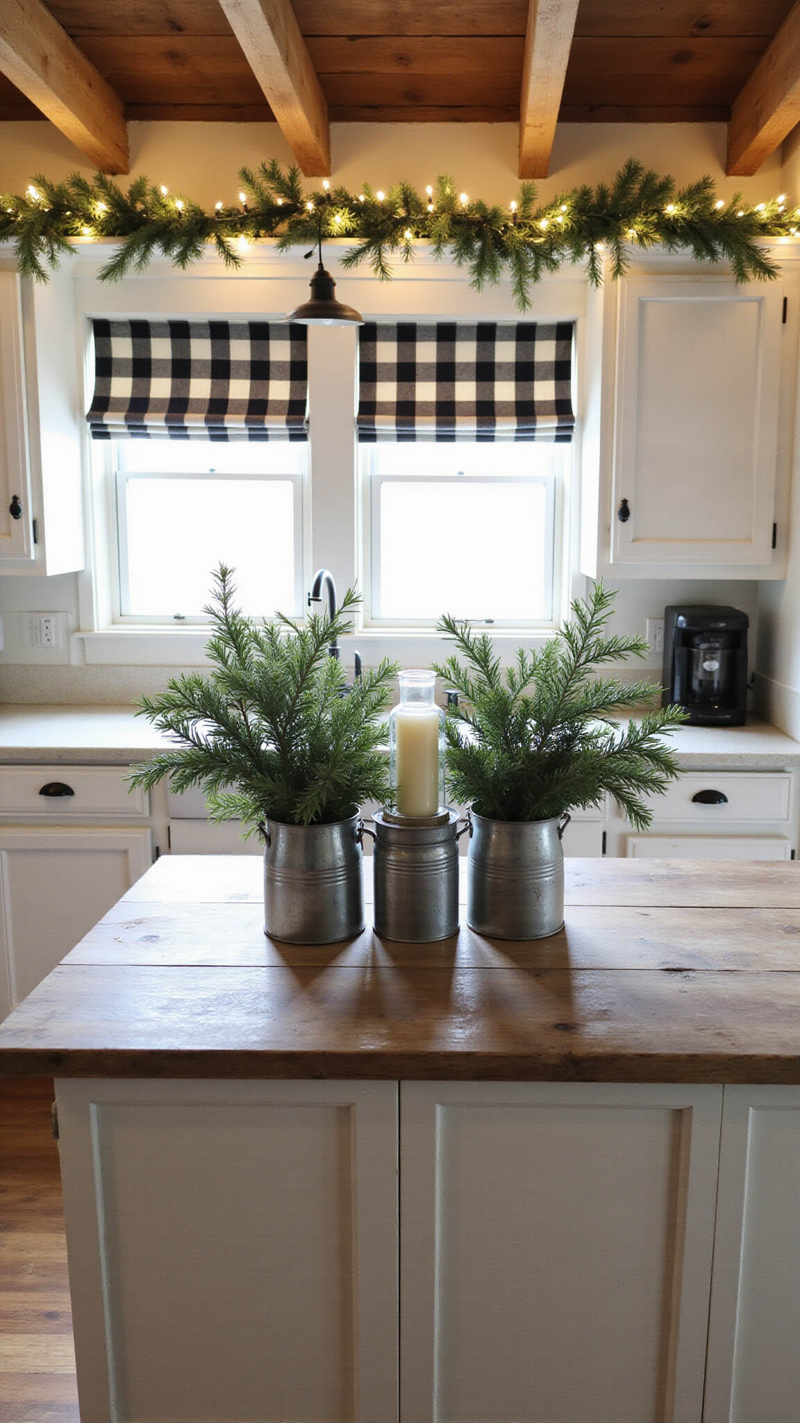Farmhouse kitchen with exposed beams, vintage white cabinets, pine garland with fairy lights, black and cream buffalo check shades, and a distressed wood island with mason jar candles.